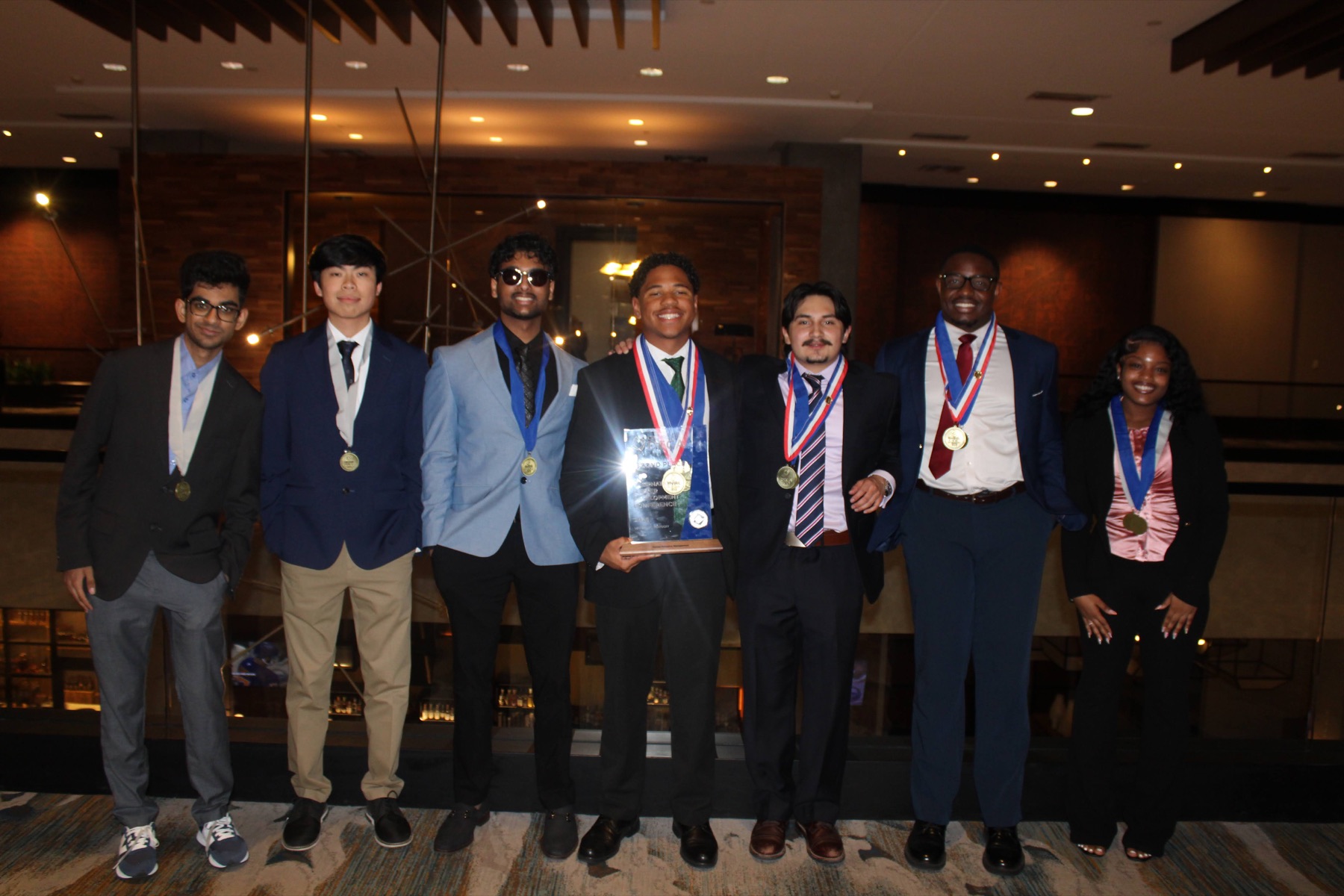 UNC Charlotte Collegiate DECA members celebrating together in Kentucky