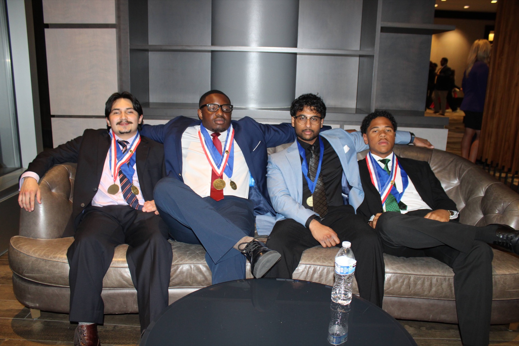 Four medal-winning members relaxing together