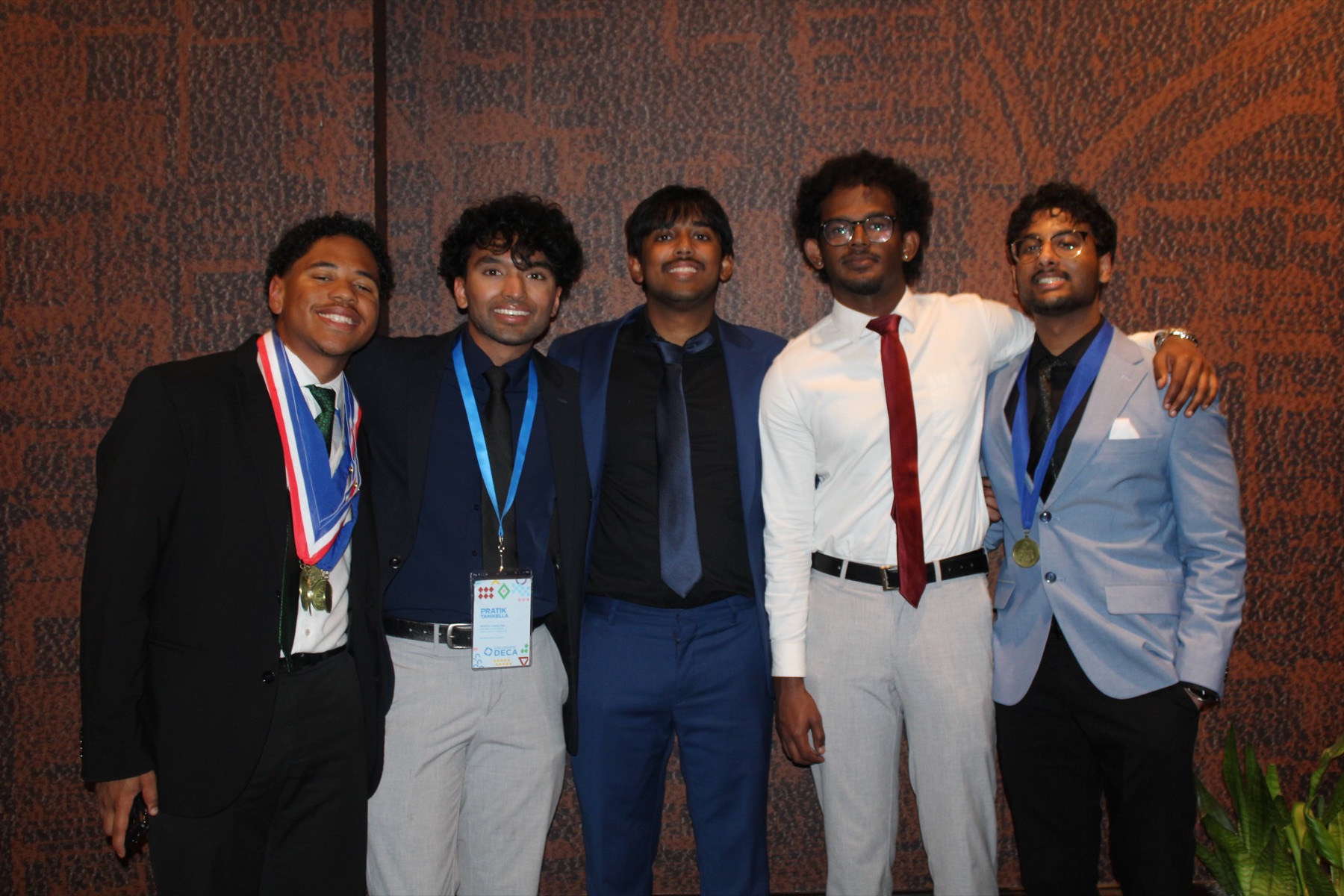 Five chapter members standing together after awards
